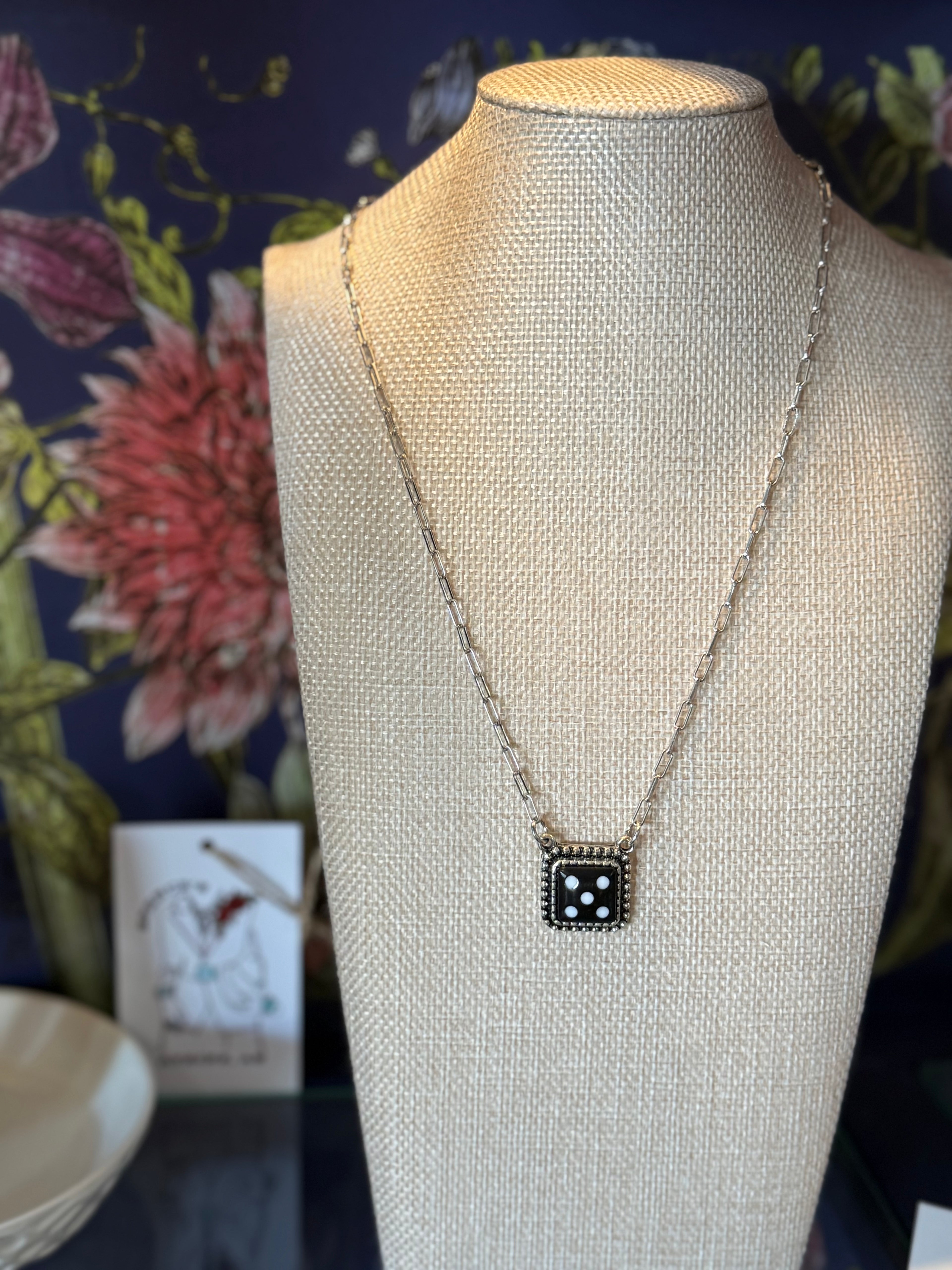 Dice necklace on paper clip chain.