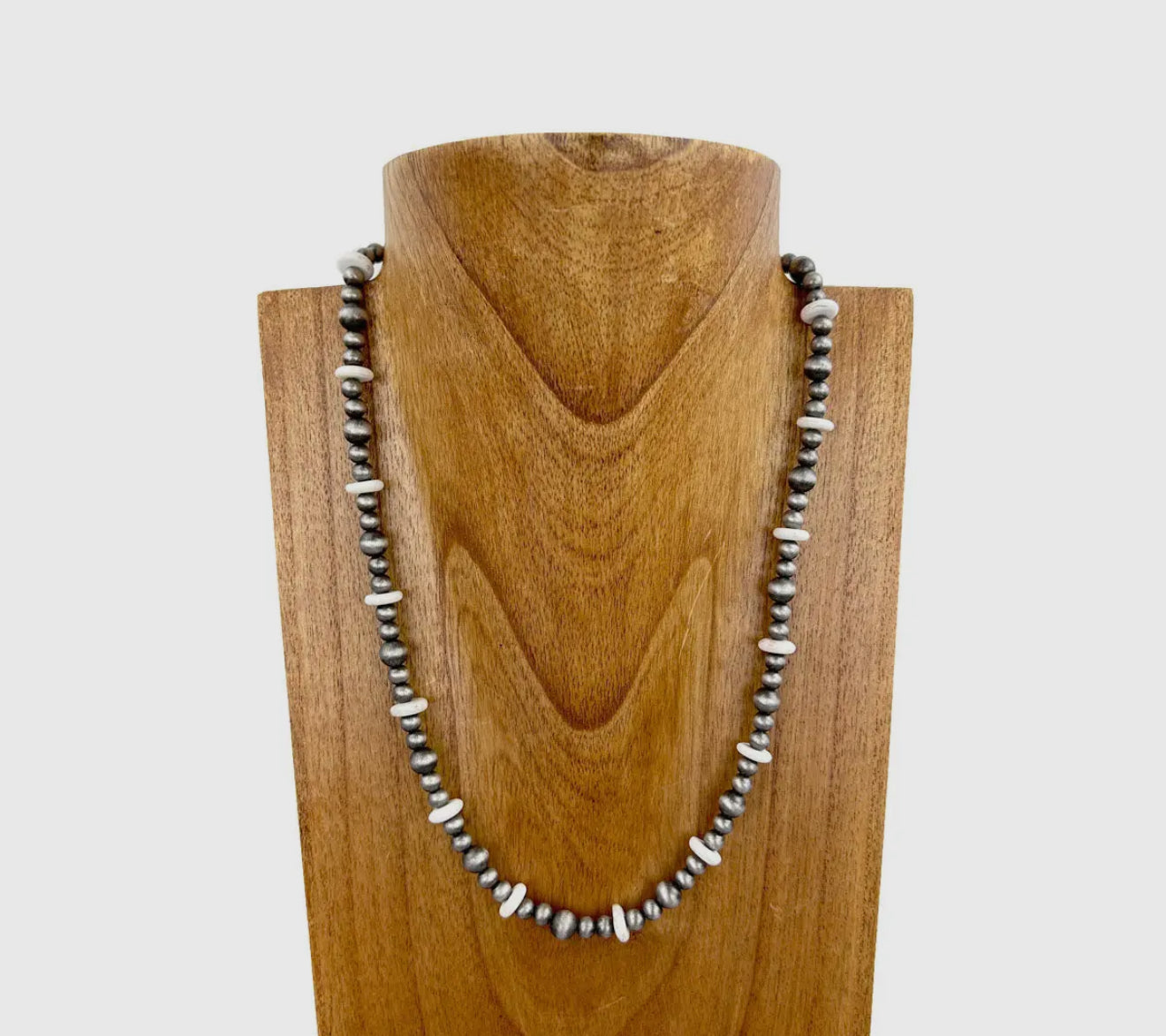 21 inch Silver necklace with white beads.