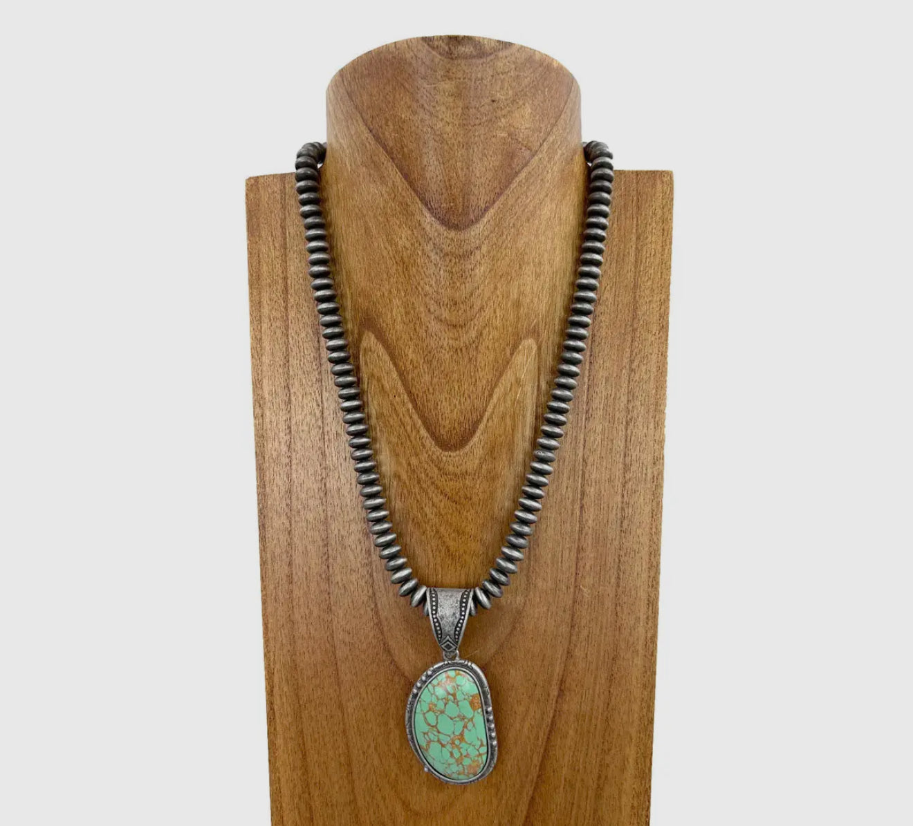 21 inches Silver Roundel necklace with Faux turquoise pendant.